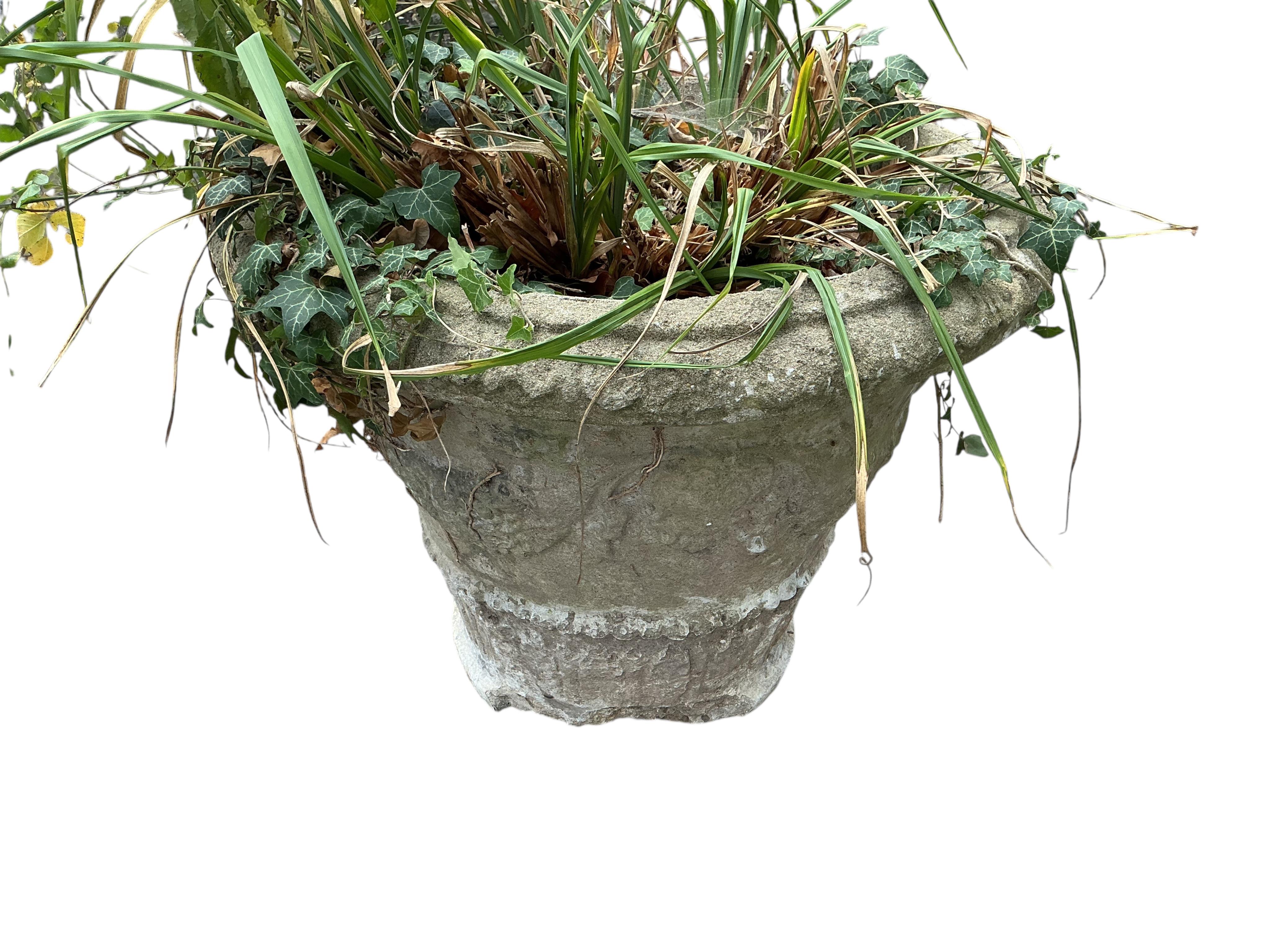 A pair of reconstituted stone garden planters, diameter 60cm, height 48cm